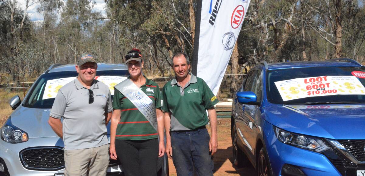 GRINNERS: Dale Isaac (Riverina Motor Group) with winner Vicki McDonagh and Gary Brill, president of Wagga Field and Game.