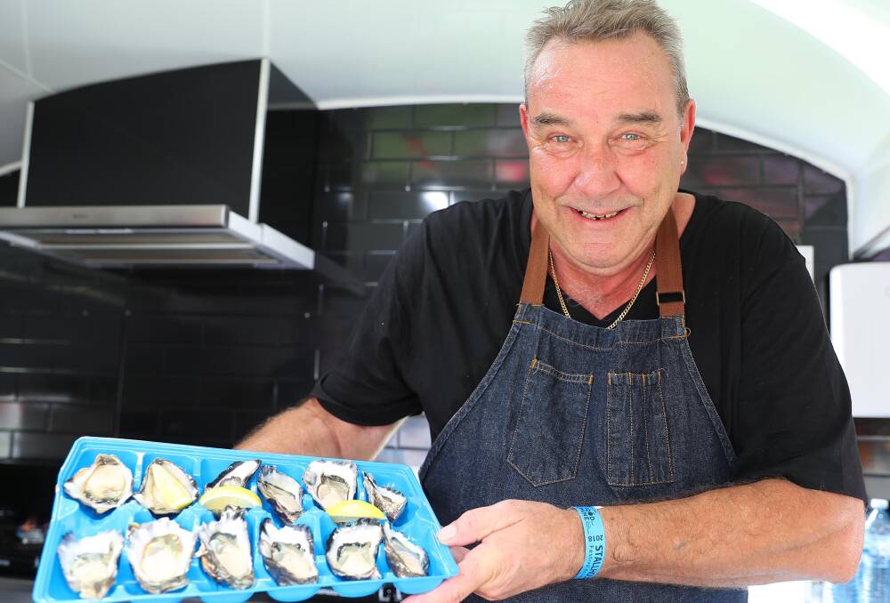 SO FRESH: Ron Lee shows off his collection of freshly shucked oysters at the festival. 