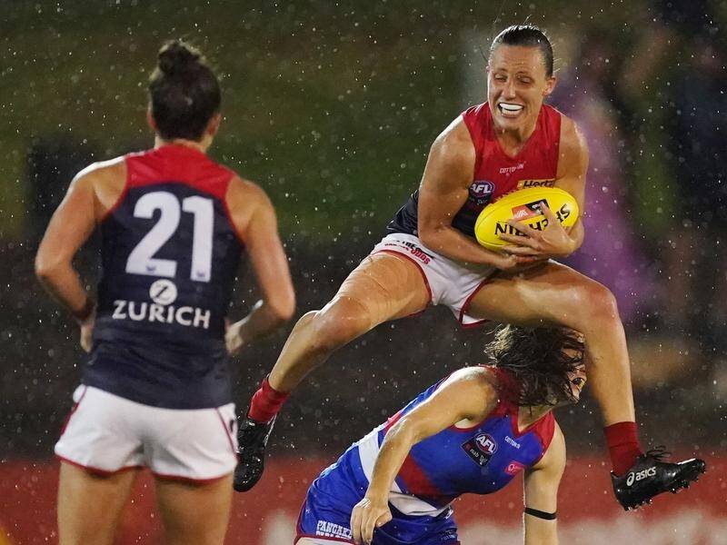 Melbourne remain unbeaten after overcoming the Bulldogs by 20 points in their AFLW clash.