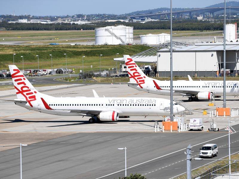A Virgin Airlines plane has become the first aircraft to depart from Brisbane airport's new runway.