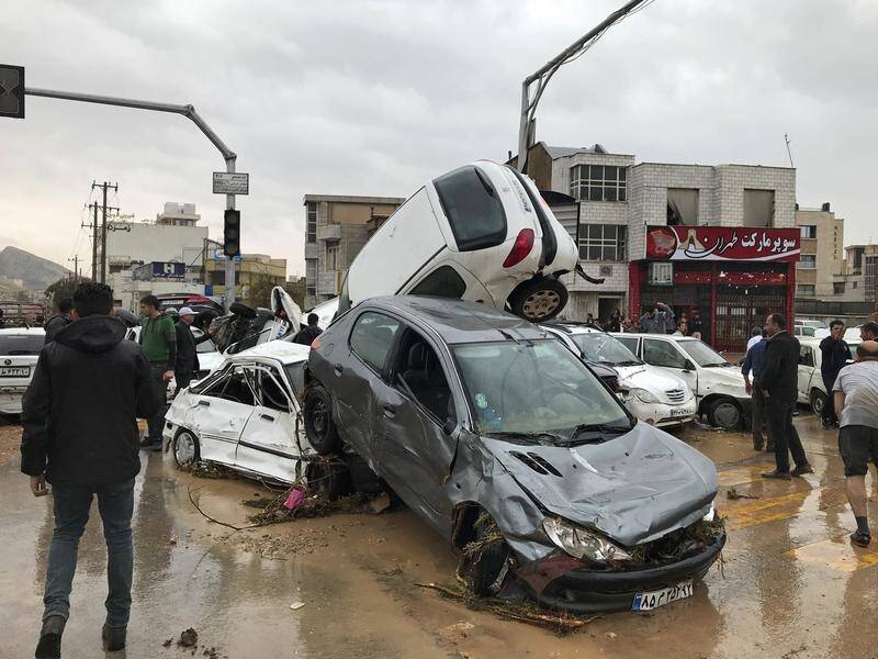 Vehicles piled up on a street after a flash flood in the southern city of Shiraz, Iran.