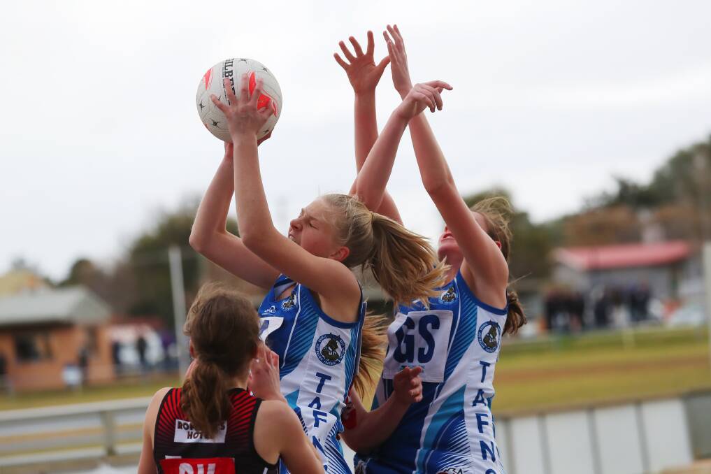 CONTEST: Temora's Abbey Reinhold wins possession in the weekend's round of Farrer League Netball. 