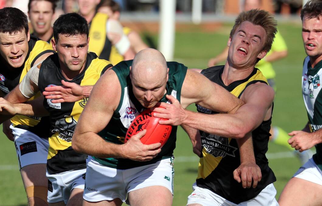 TACKLE: Dylan Morton tackles Connor Neyland during the weekend's round of the Riverina Football League. Photo: LES SMITH